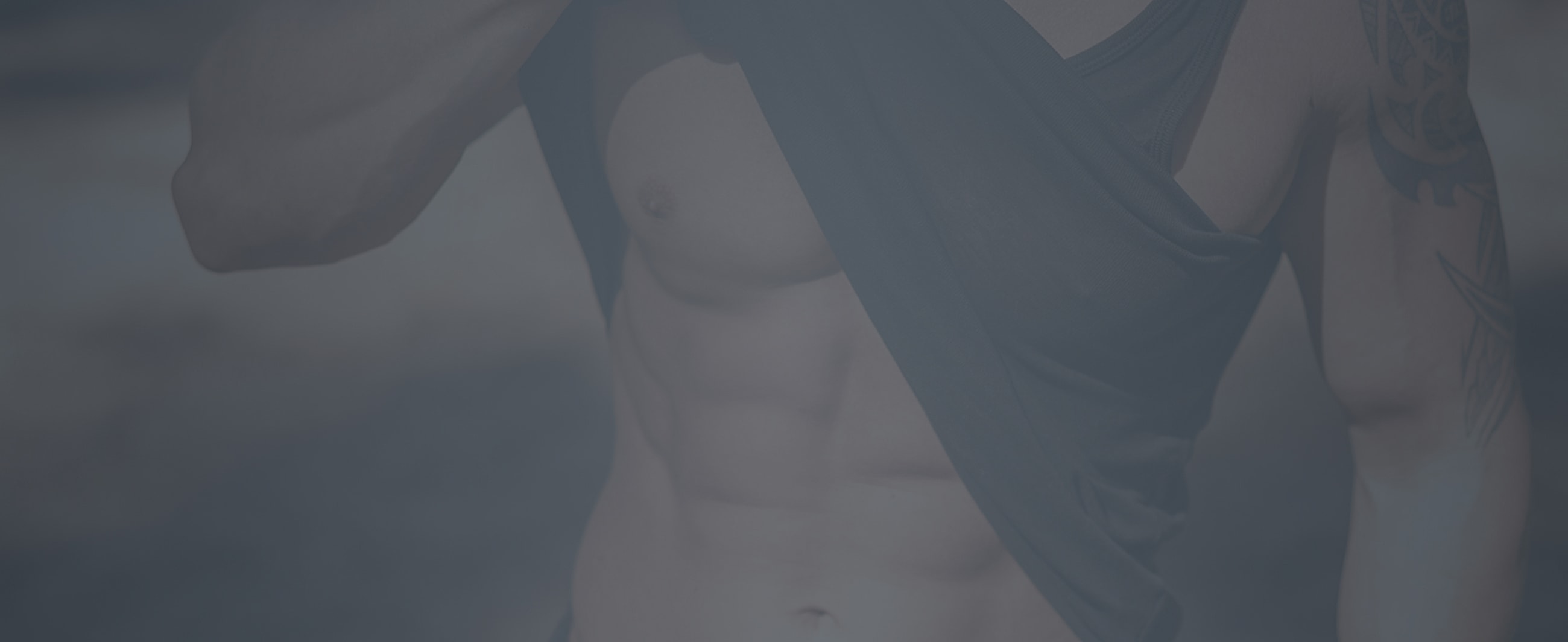 Person in tank top showing toned physique.