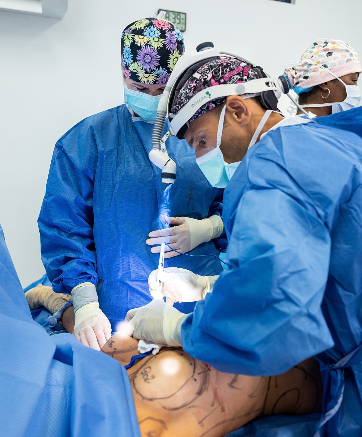 Surgical team performing a procedure in operating room.
