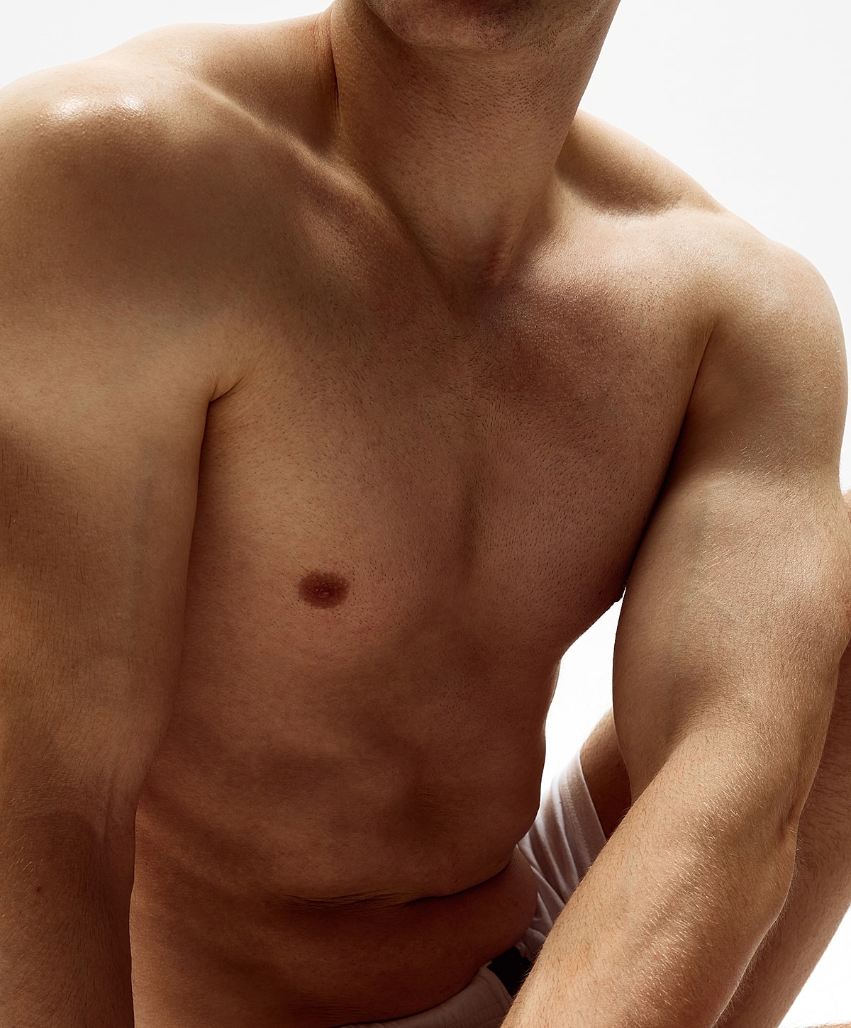 Gainesville, FL gynecomastia Surgery model with light skin and athletic build.