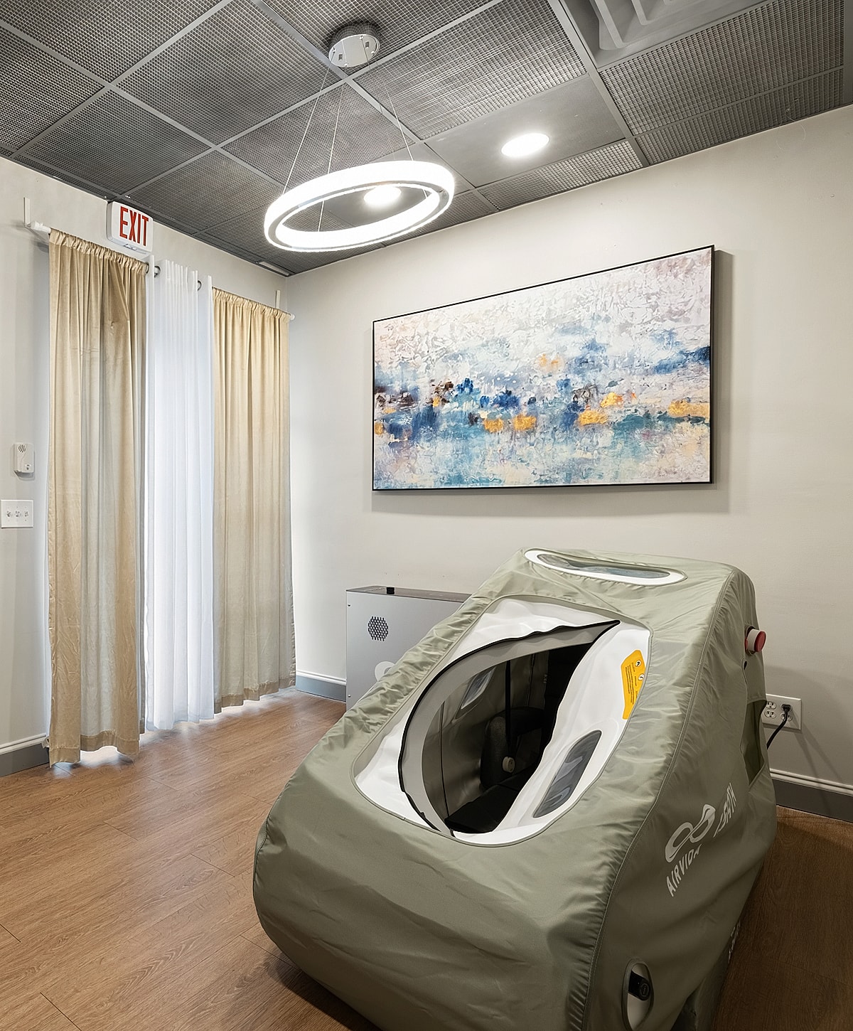 Wellness therapy room with air compression device.