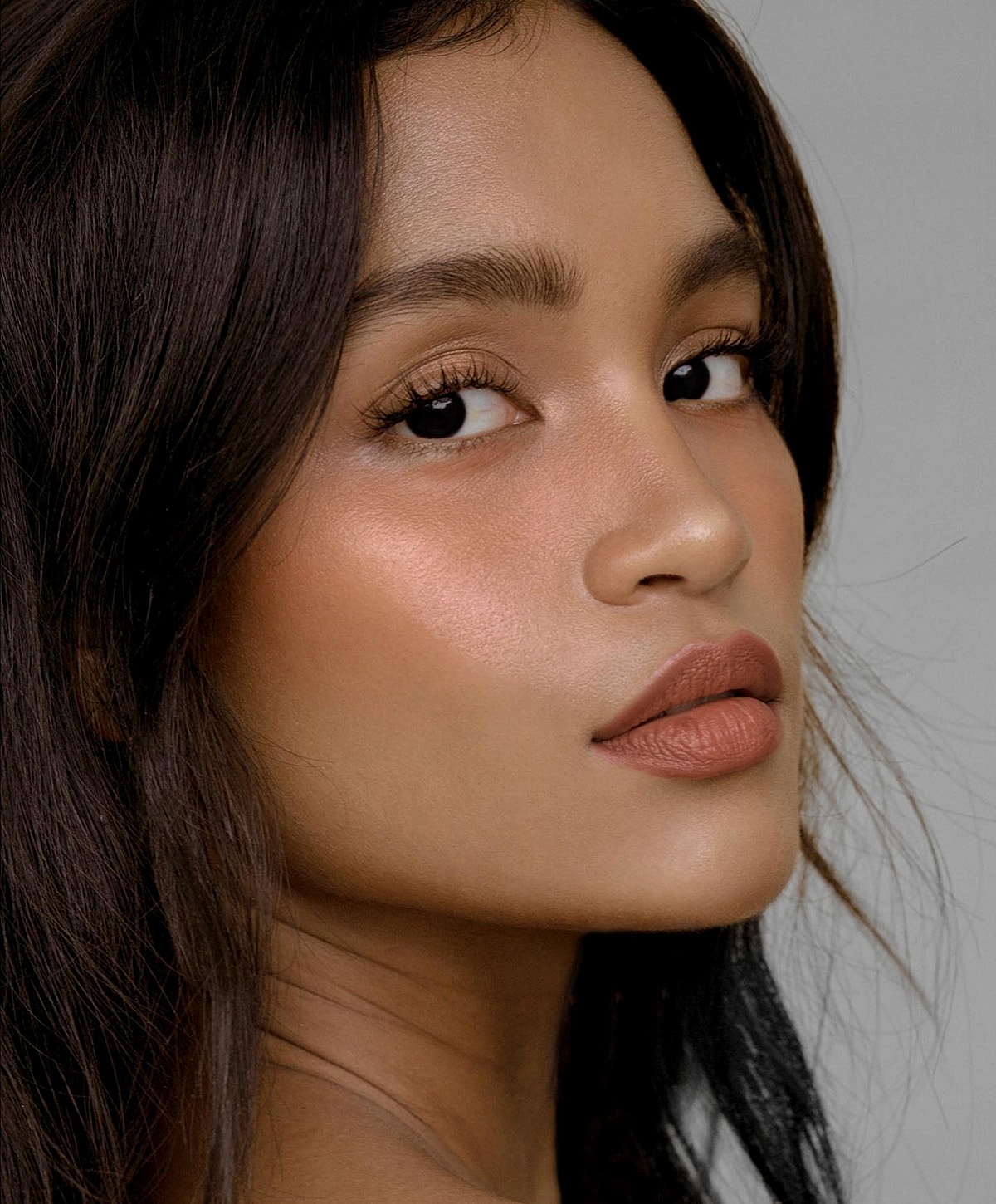 Close-up portrait of a woman with natural makeup.