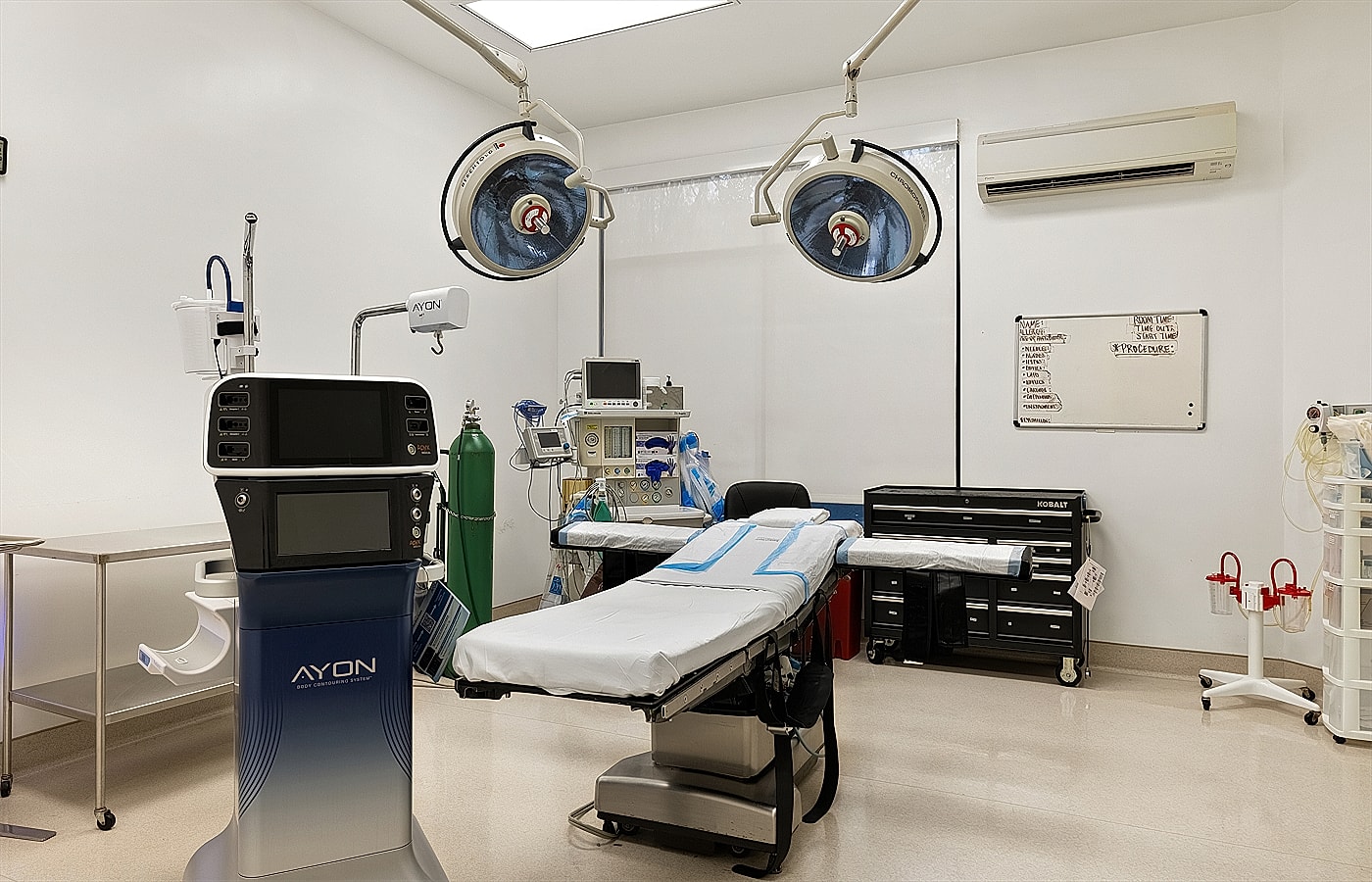 Surgical room equipped with medical instruments and supplies.