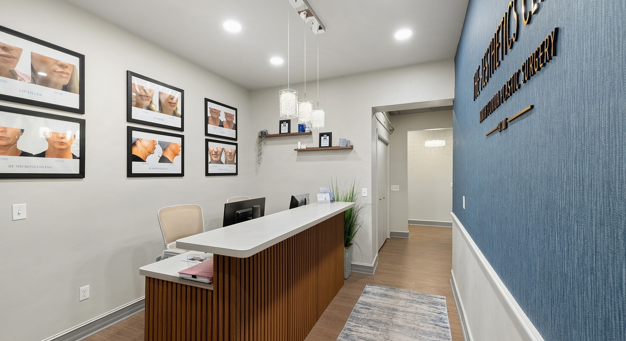 Modern aesthetic clinic reception area with displays.