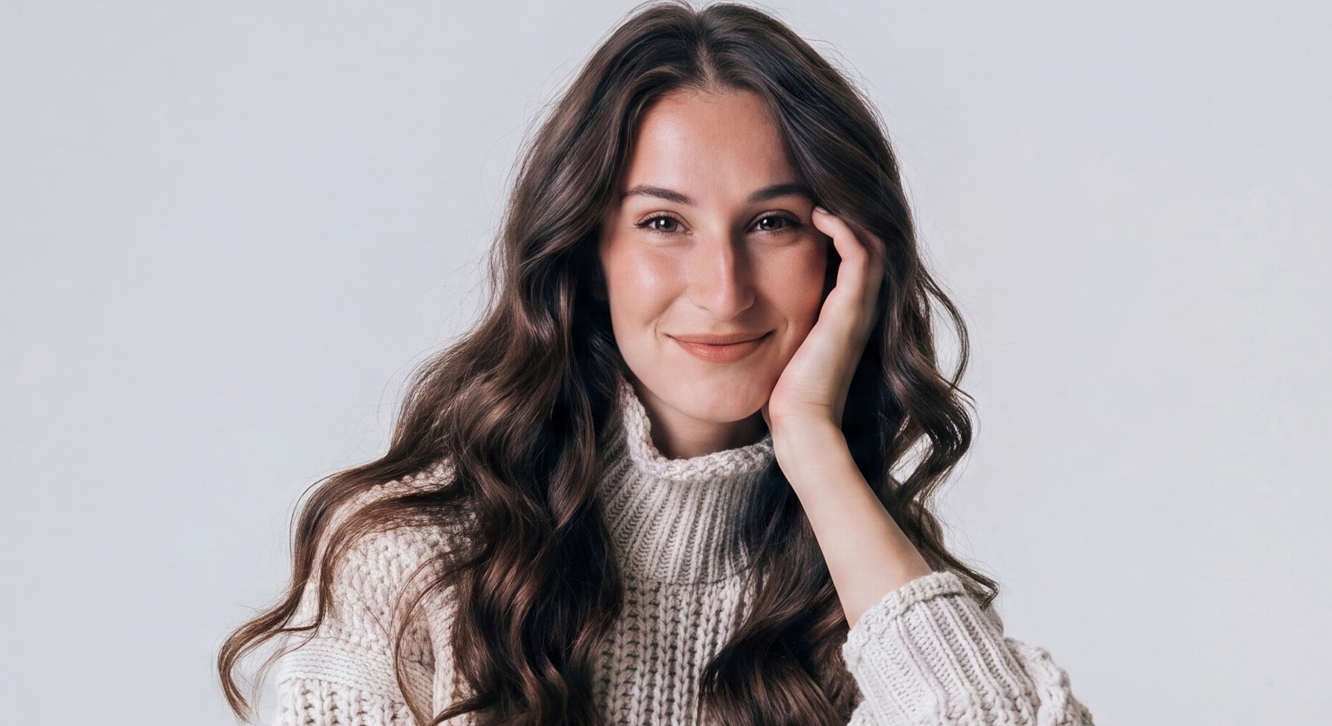 Smiling woman with long hair in cozy sweater
