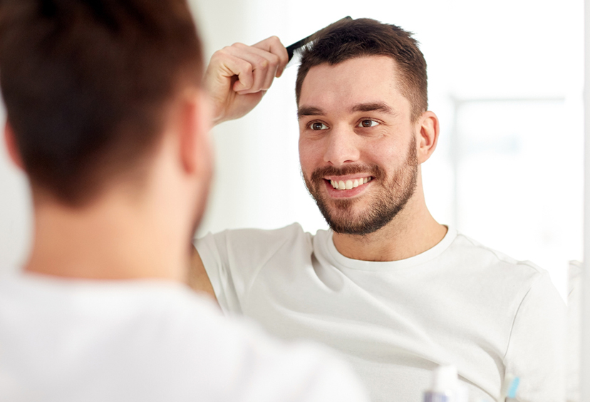 Man brushing his hair