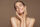 Woman holding her face and smiling