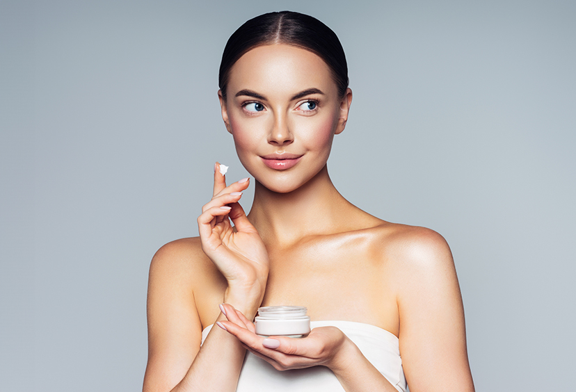 Woman applying skin care