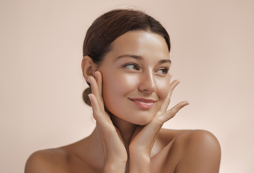 woman holding her face