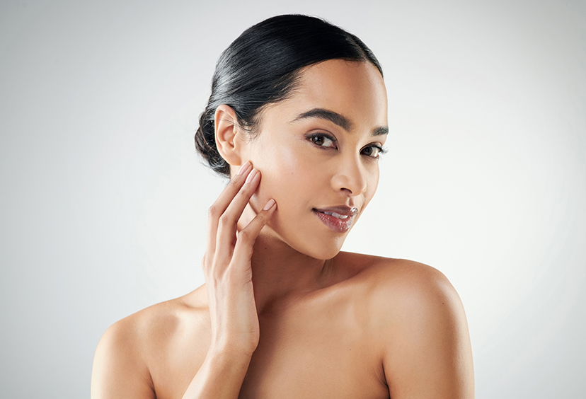 model touching her face